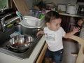 Helping daddy wash the dishes